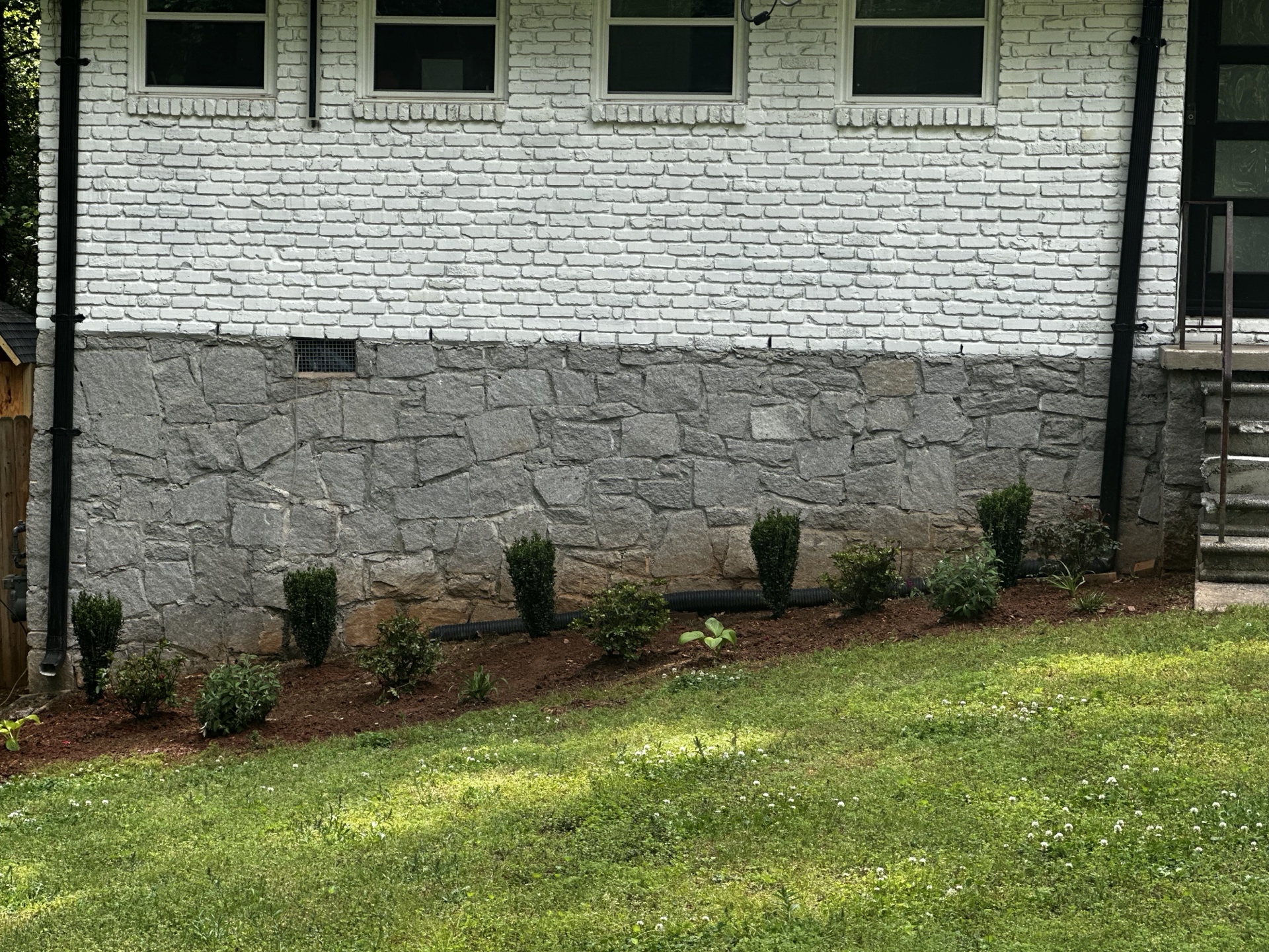 New shrubs and plantings along foundation