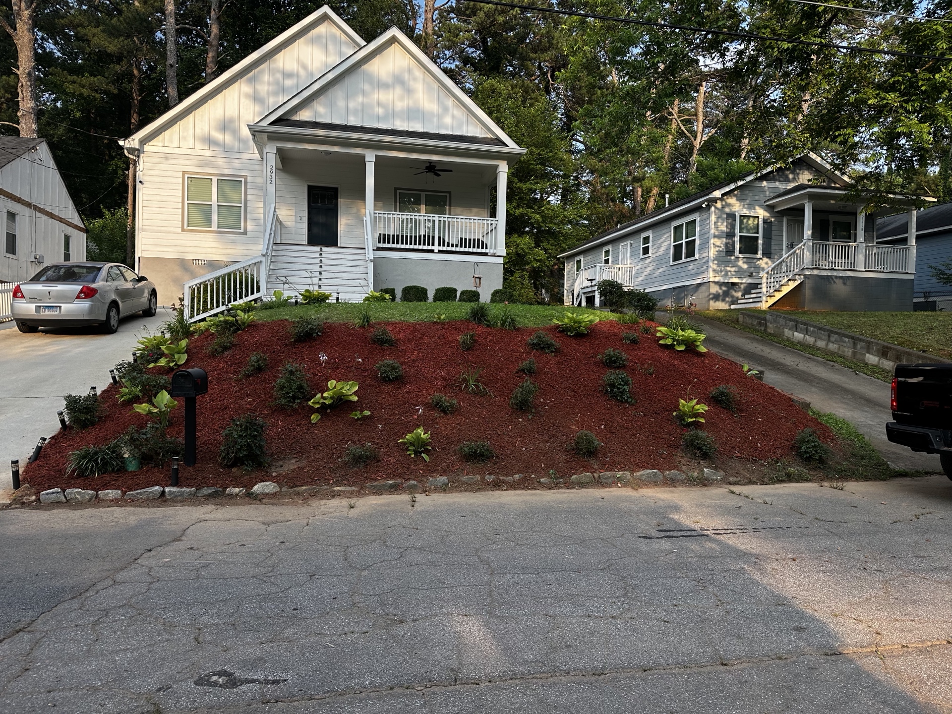 Full red mulch coverage with organized shrubs
