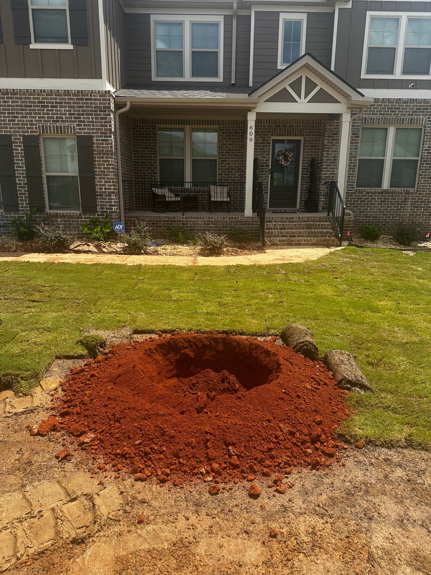Dug hole in front yard for tree planting